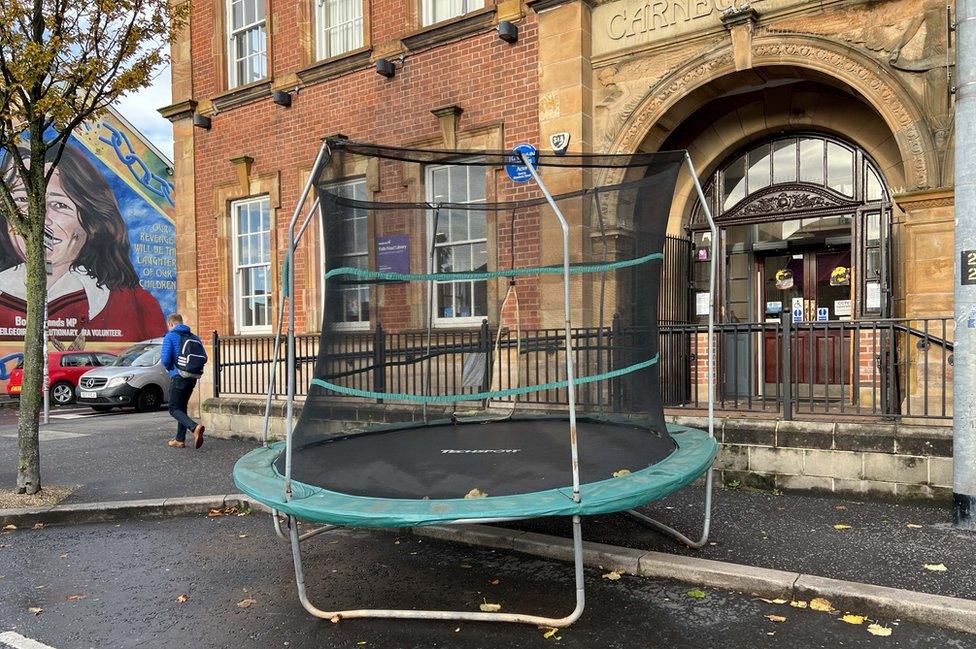 A trampoline at the front door of Falls Road Library in Belfast