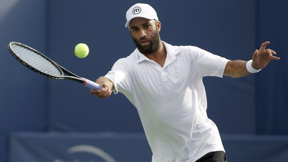 James Blake hits a forehand against Rhyne Williams on August 19, 2013 in Winston Salem, North Carolina.