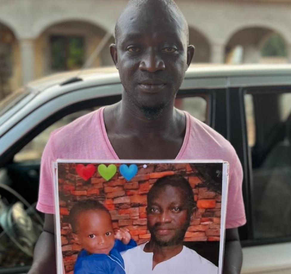 Father with a picture of his son