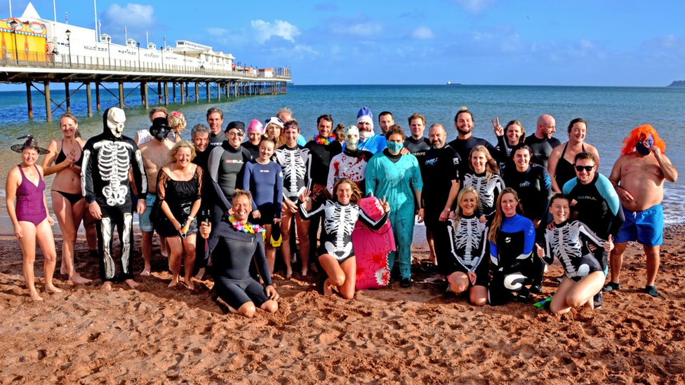 People on the beach before the swim