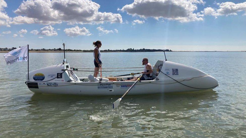 Nina and Simon Crouchman on a boat on the water