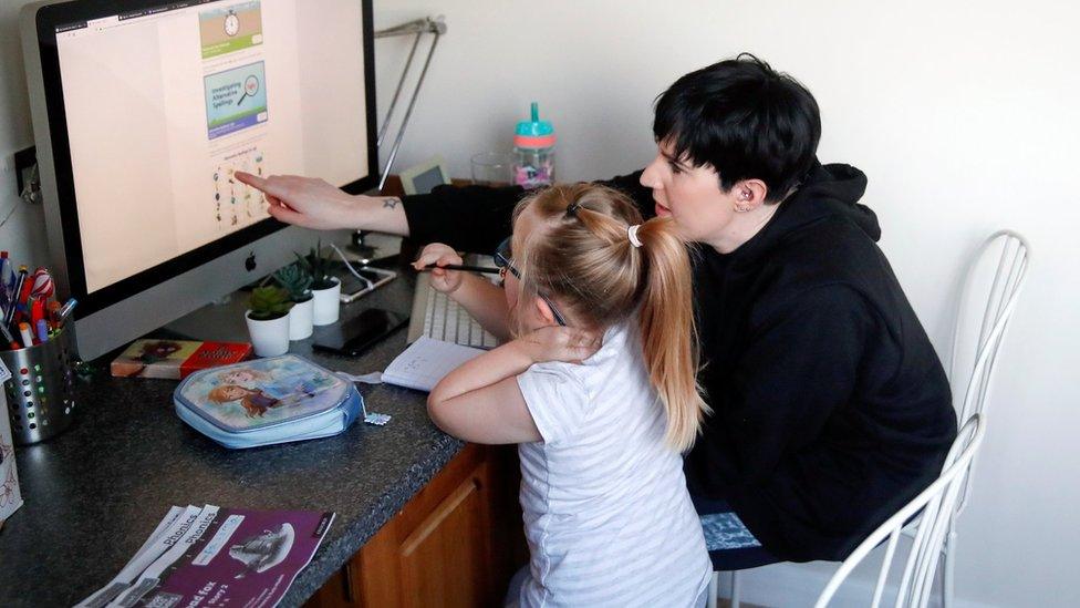 A parent and child learning at home