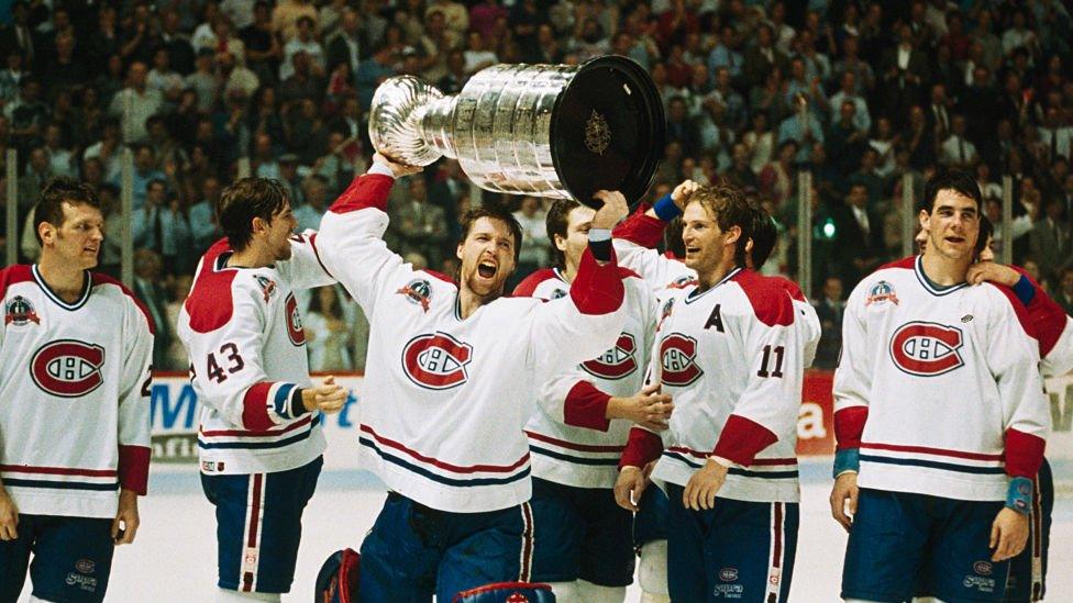 Patrick Roy of the Montreal Canadiens celebrates with the Stanley Cup after 1993 win