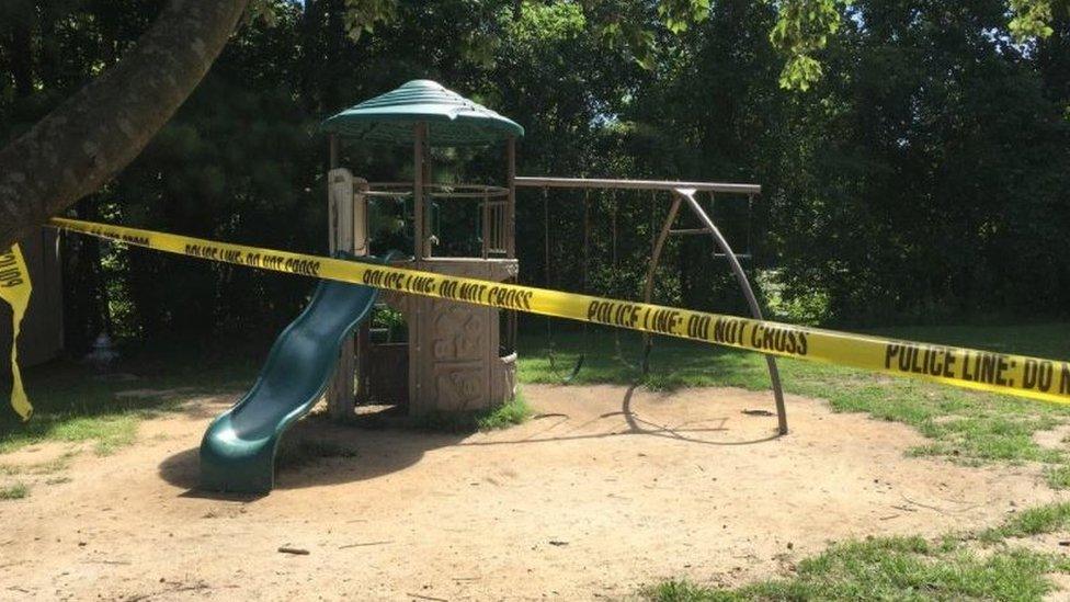 Police tape at a children's play area at the crime scene