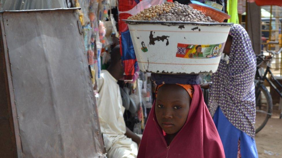 A girl selling food in Kano, Nigeria