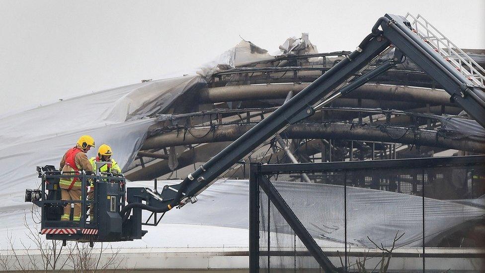 Firefighters near the roof