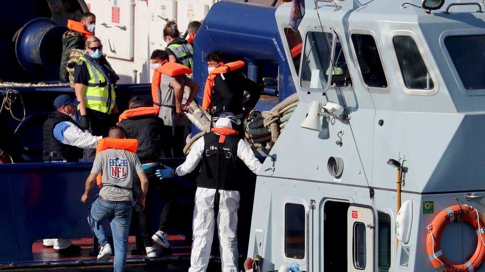 Border Force vessel brings a group of men thought to be migrants into Dover, Kent