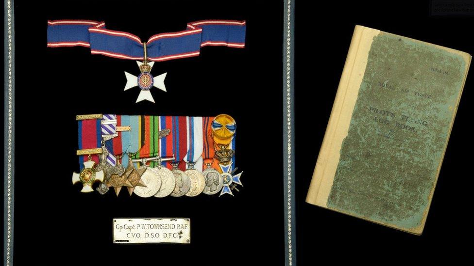 Group Captain Peter Townsend's medals and flying log book.