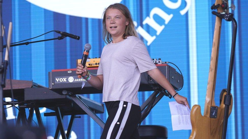 Climate activist Greta Thunberg speaking on the Pyramid Stage during the Glastonbury Festival