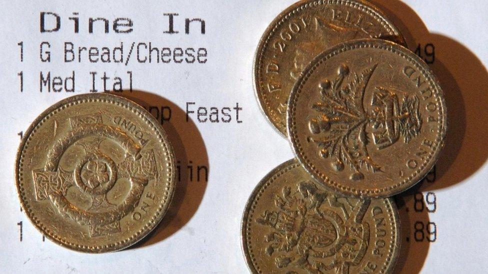 Pound coins on a receipt