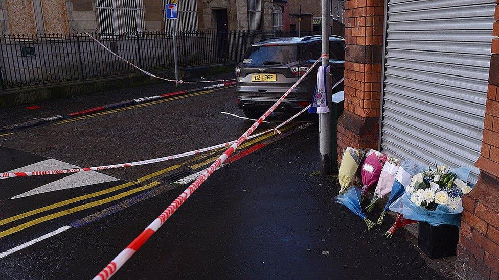 Flowers at the scene of Ian Ogle's murder