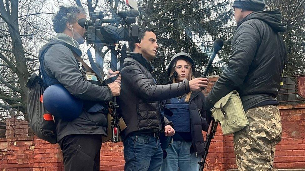 Cameraman Pierre Zakrzewski (left) and journalist Oleksandra Kuvshinova (seen here wearing a helmet and protective vest)