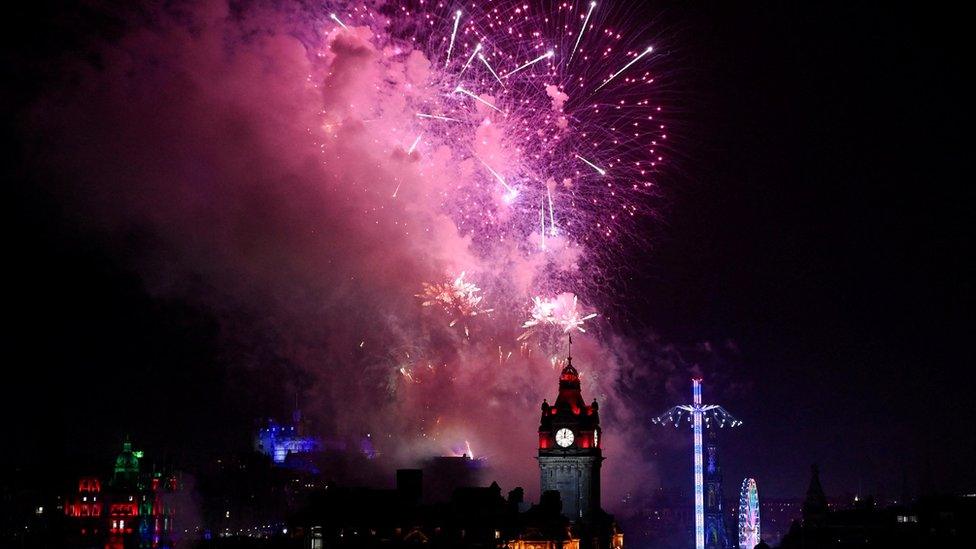 Fireworks light up the sky over Edinburgh Castle and the Balmoral Clock to mark the New Yea