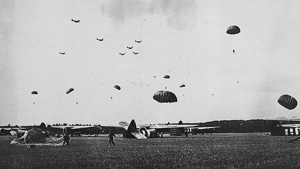 Parachute troops landing