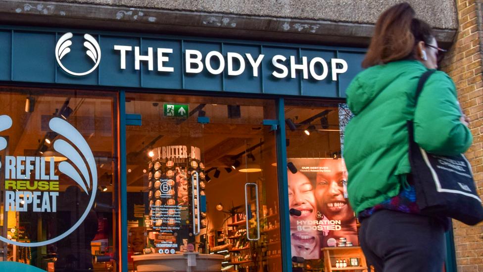 A woman walks past a Body Shop store in Central London on 12 February 2024