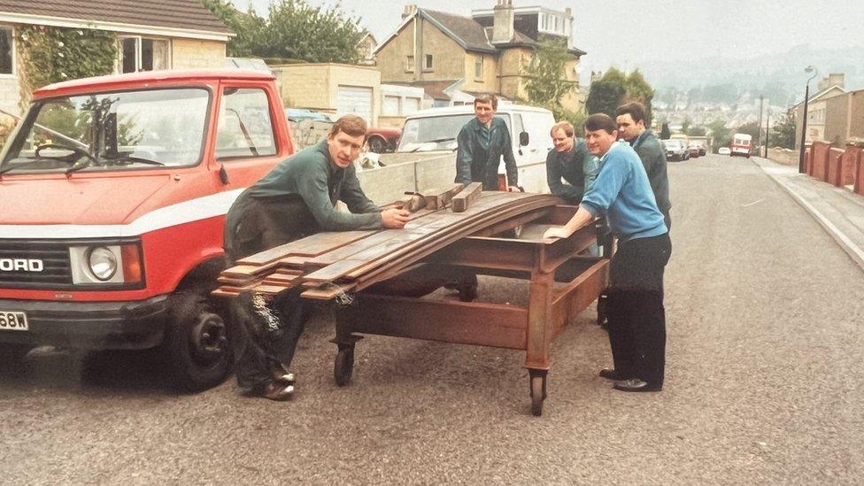 5 men loading steel.