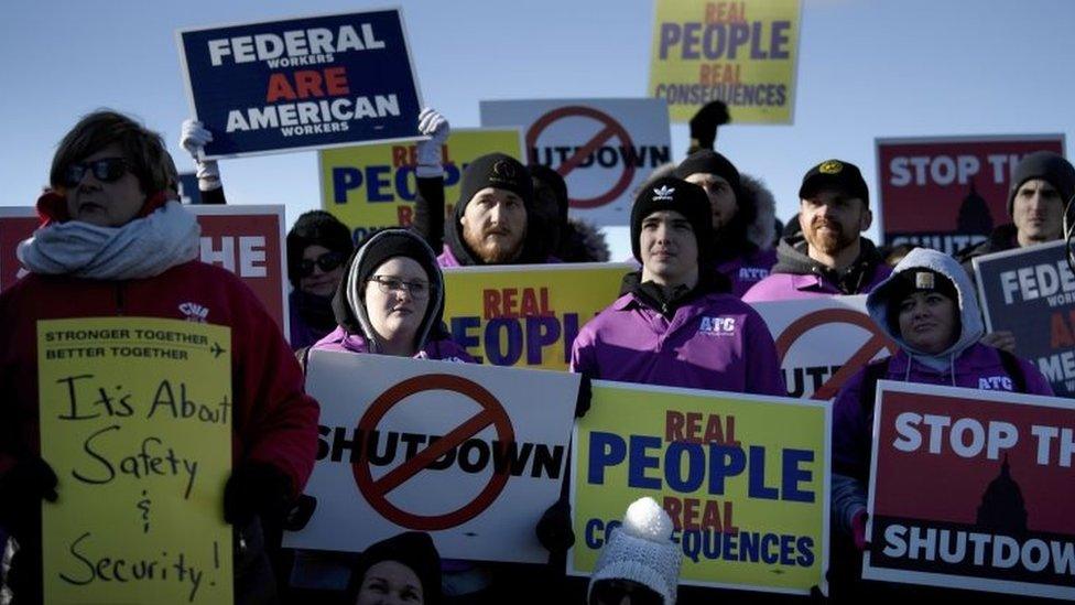 People attend a rally of air traffic control and other airline industry unions