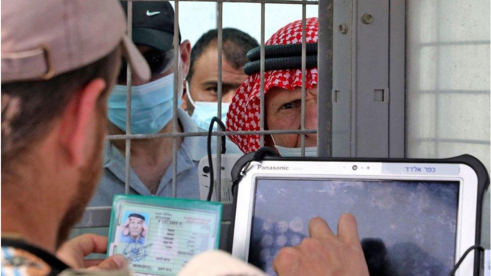 Palestinians having their ID checked at Bethlehem checkpoint (file photo)