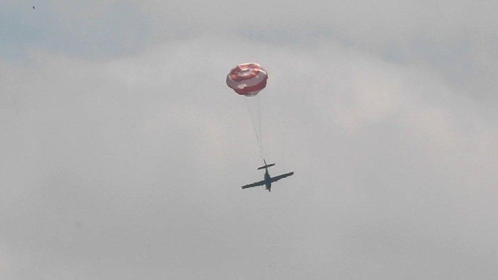 Plane with parachute