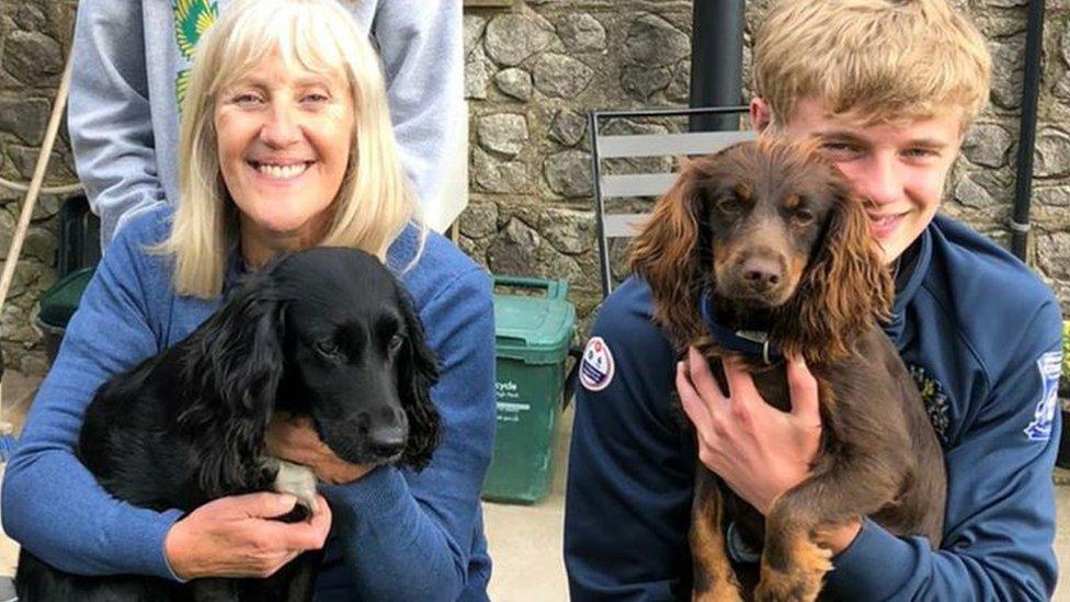 Kay Heathcote and her grandson with her dogs