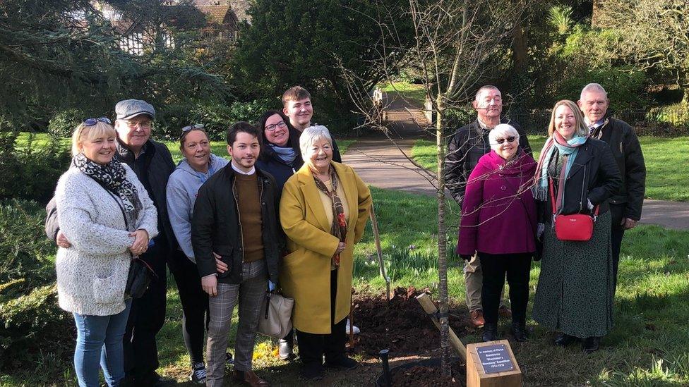 A tree is planted in memory of Perce Blackborow in Bellevue Park, Newport