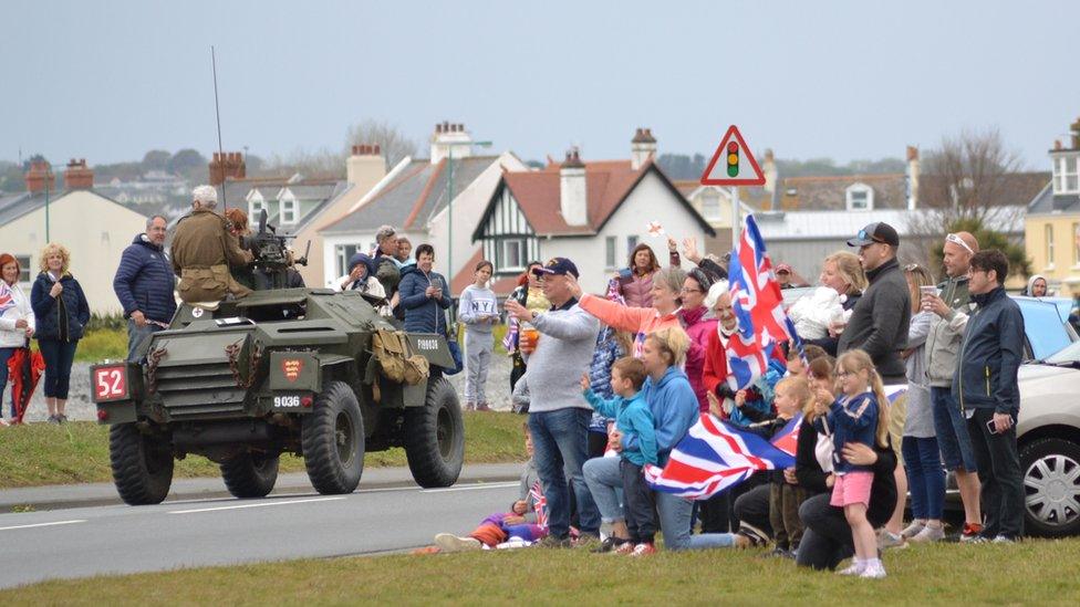 People watching the Cavalcade with Union flags