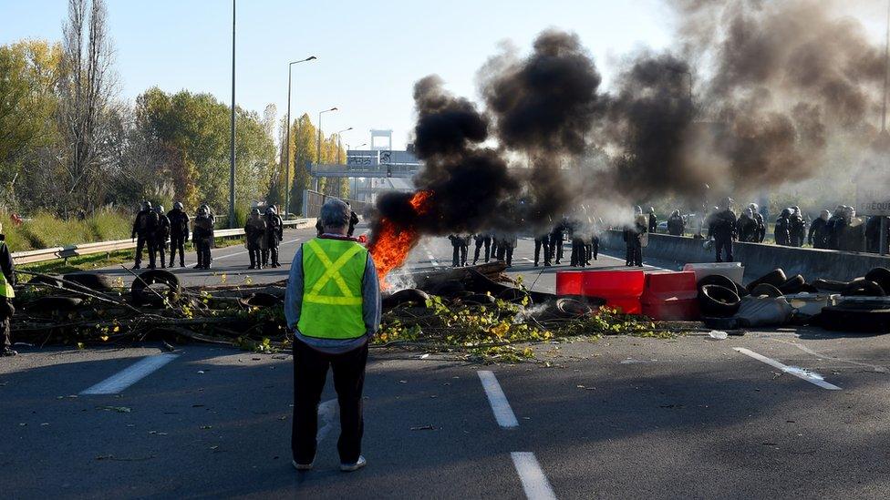 Riot police face protestors blocking the ring-road in Bordeaux, France