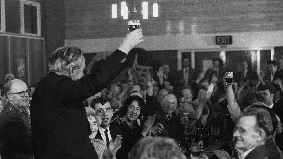 Harold Wilson toasts the members of a working men's club in his Huyton constituency, 1964