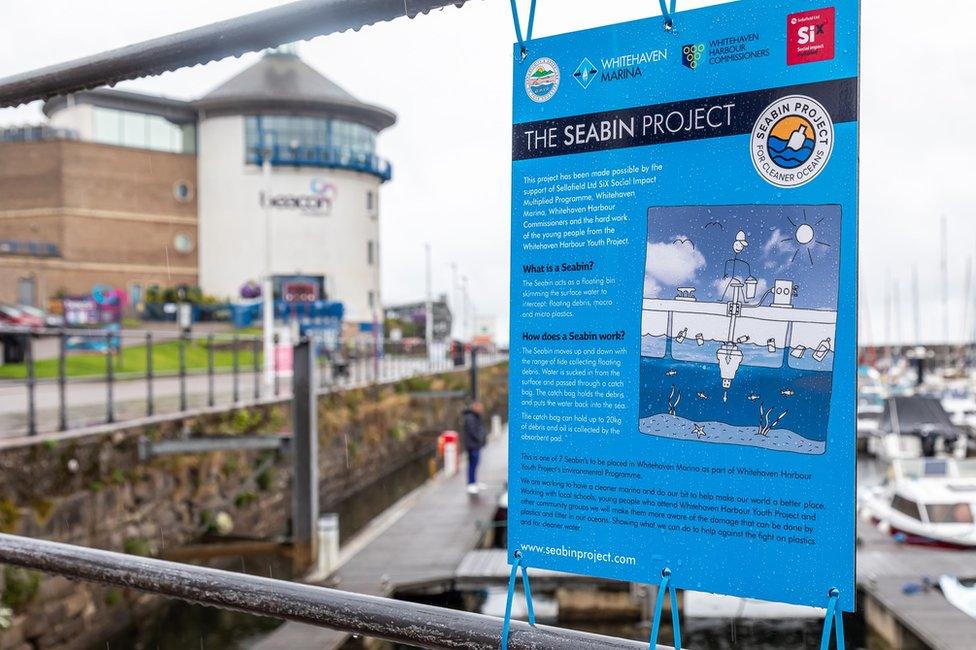 A sign at the harbour about the project