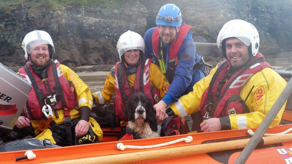 RNLI crew with rescued dog
