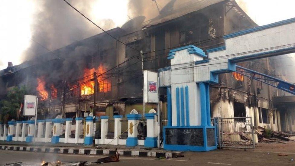 A local parliament building burns during a protest in Manokwari, West Papua, Indonesia