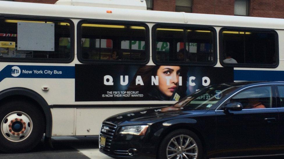 A bus with a Quantico poster featuring Priyanka Chopra