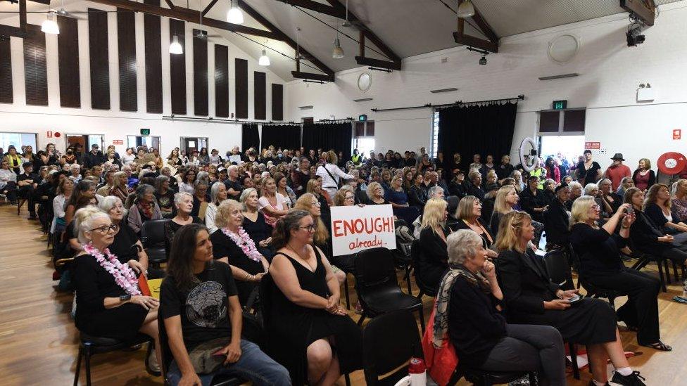 Locals gather into a hall in Mullumbimby for a March 4 Justice protest