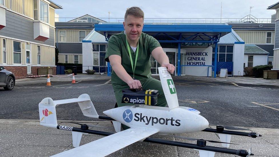 Mark Knowles, pharmacy head of production, and the drone