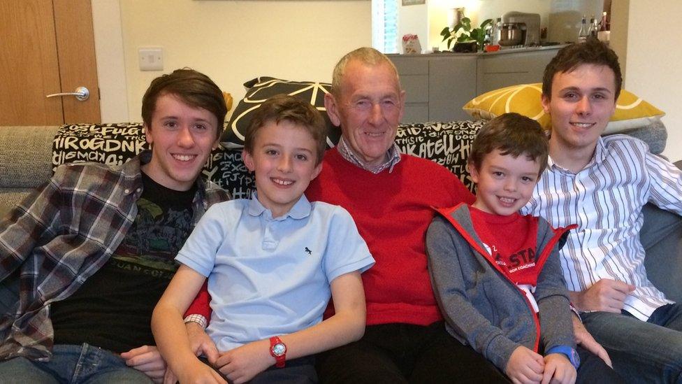 Lloyd Erskine (centre) with his family