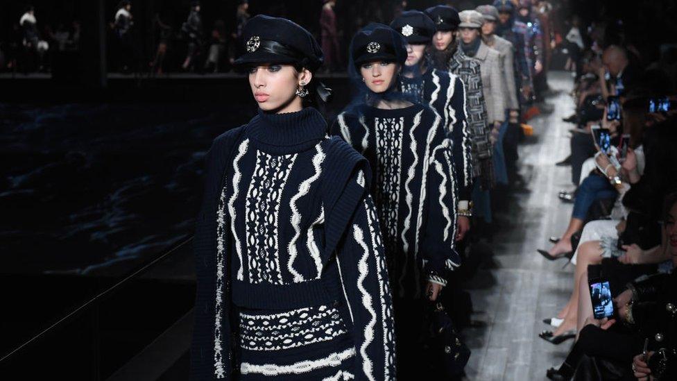 Models walk in a Chanel fashion show in Moscow in 2018