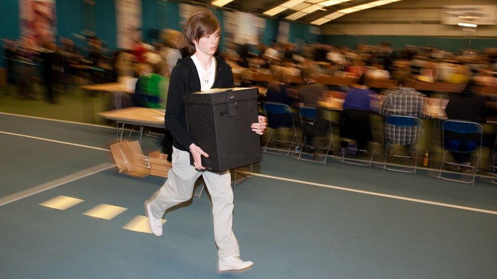 Teen runs with ballot boxes