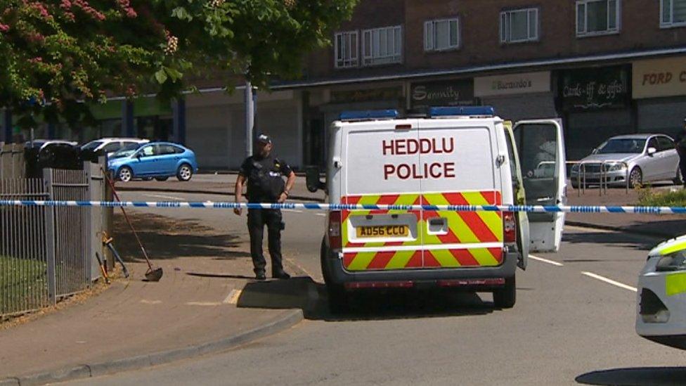 A police cordon near shops in Llanrumney