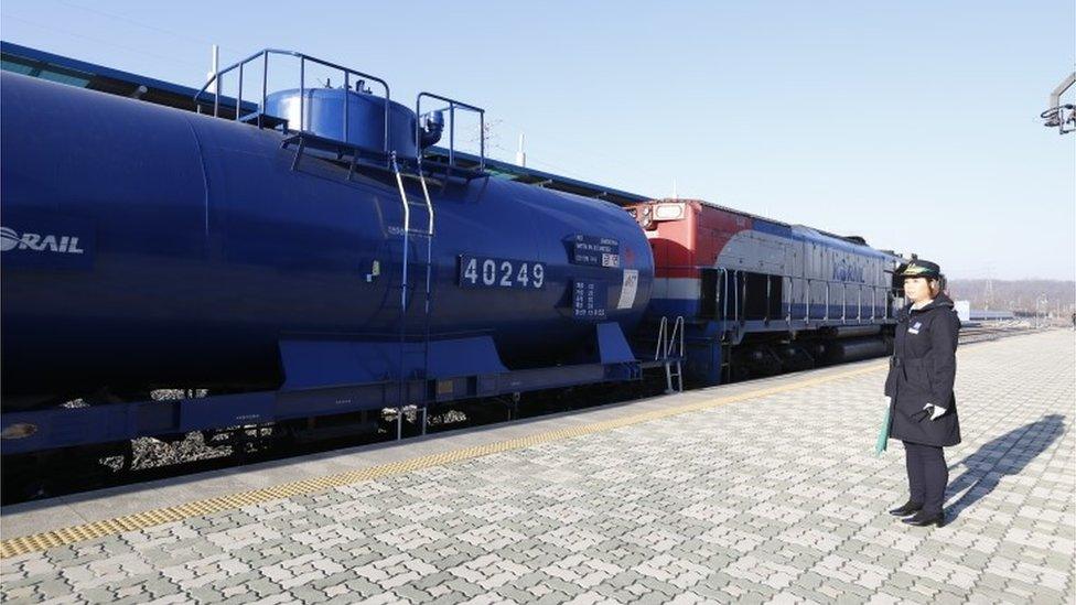 A South Korean official stands next to the train in Paju, South Korea (30 Nov 2018)