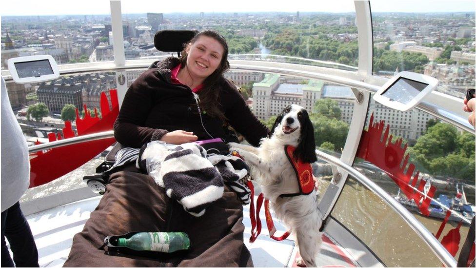 Lucy Watts on the London Eye with her support dog Molly