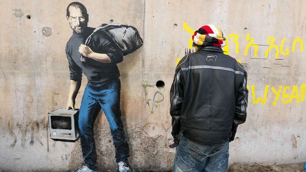 Banksy artwork at the Jungle refugee camp showing Steve Jobs