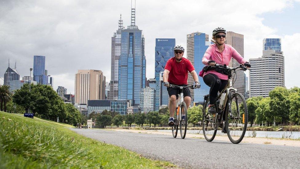 People enjoy riding bicycles along the Yarra River on November 19, 2020 in Melbourne, Australia