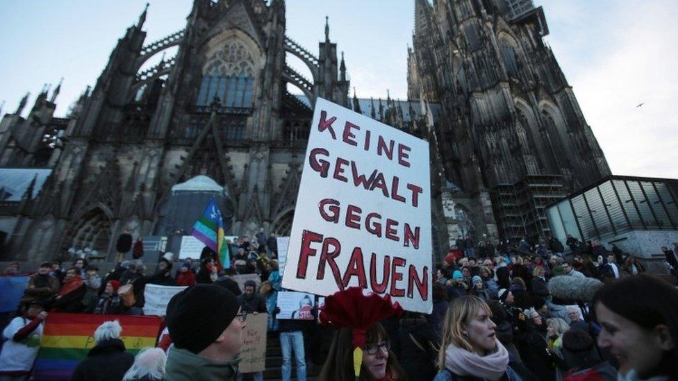 A demonstrator holds a sign in German that reads "No violence against women" during a demonstration in the wake of the sexual assaults on New Year's Eve, outside the cathedeal in Cologne, Germany, 09 January 2016