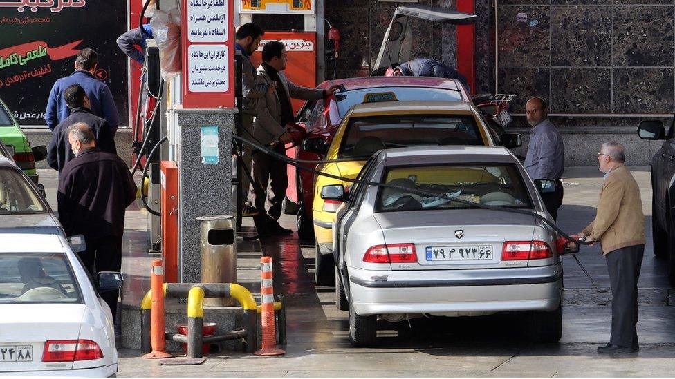 Iranians drivers refuel their vehicles at a gas station in the capital Tehran on January 19, 2016