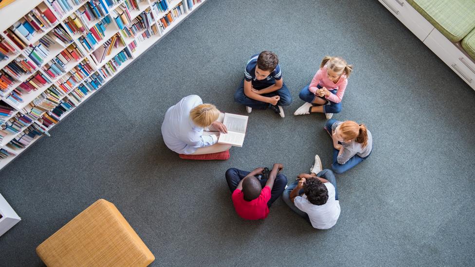 Pupils listening to a story