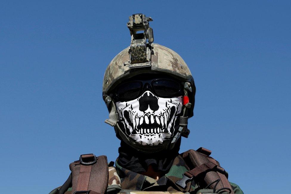 An Afghan Special Forces member attends his graduation ceremony in Kabul, Afghanistan, 17 June