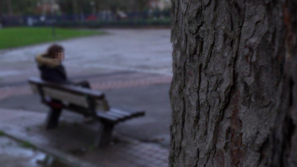 Marie (not her real name) sitting on a bench