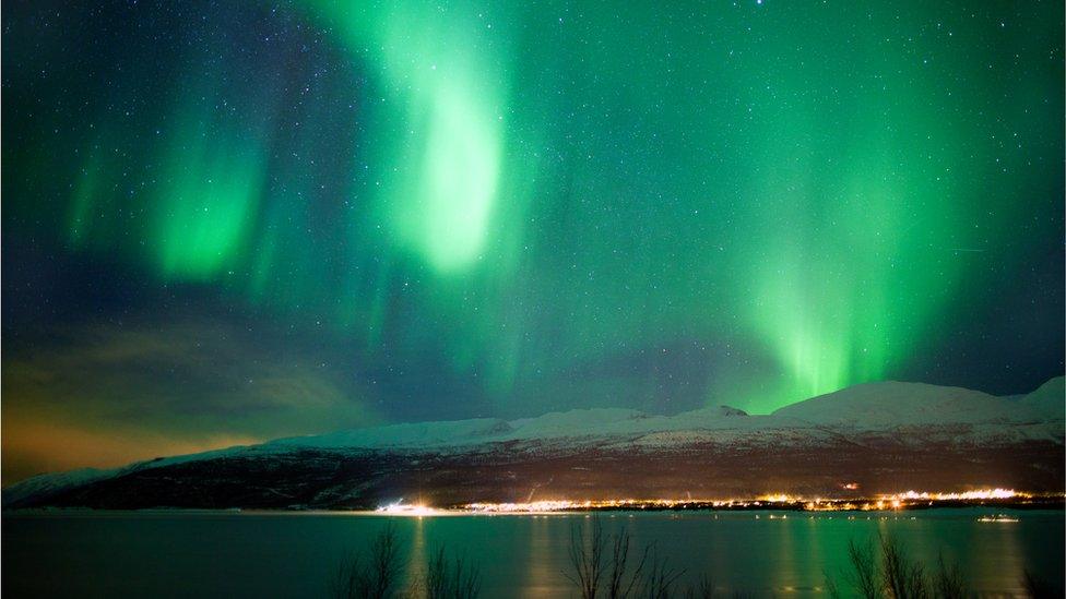 The northern lights reflected in the sea