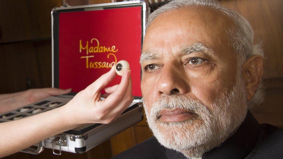 Narendra Modi models for his wax statue