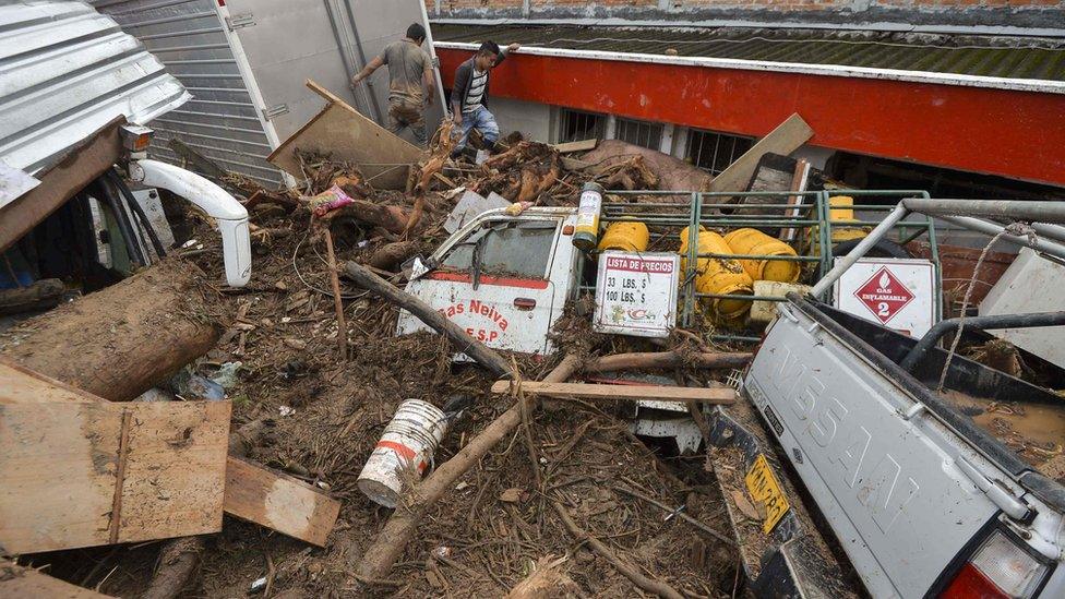 Lorries and trucks were thrown into the side of buildings by the force of the water